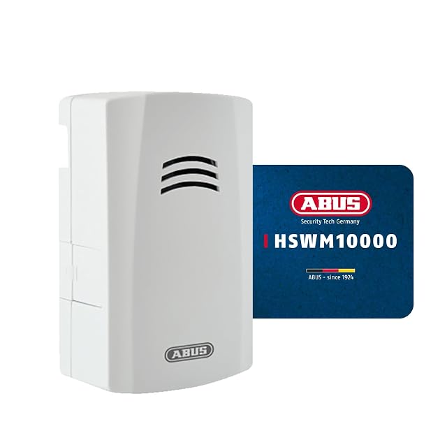 ABUS water alarm standing on a floor beside a washing machine